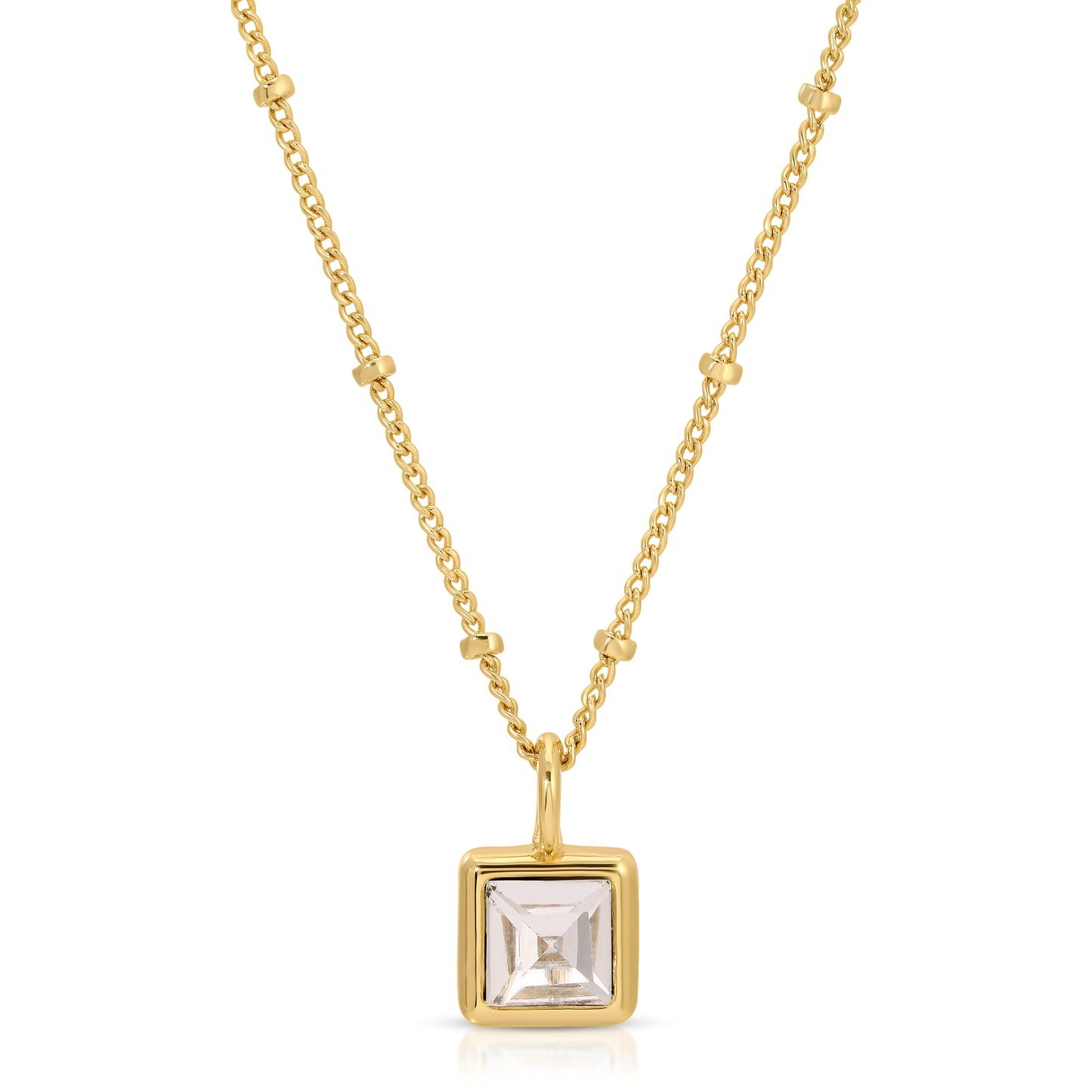Gold necklace with a square pendant.
