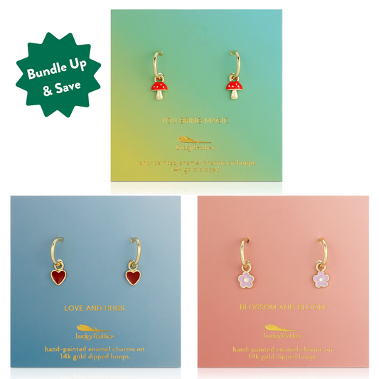 Three pairs of gold hoop earrings with charms on display cards with a 'Bundle Up & Save' graphic.