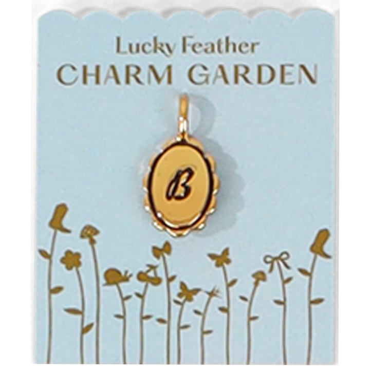 A 'Lucky Feather CHARM GARDEN' display card shows a gold pendant with the letter 'B.'