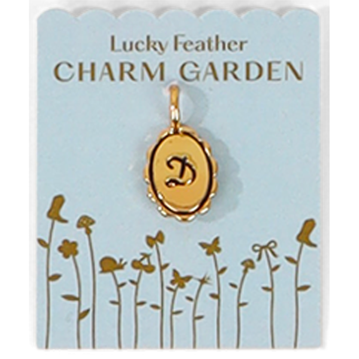 A gold letter 'D' pendant on a 'Lucky Feather Charm Garden' card.