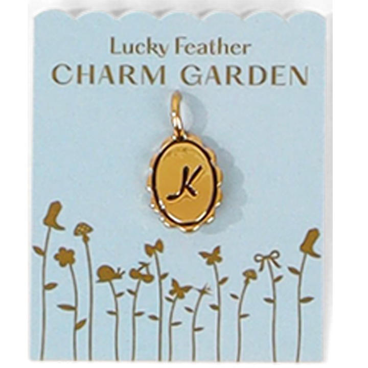 A 'Lucky Feather Charm Garden' card features a gold-colored charm with the letter 'K' and a whimsical flower garden design.