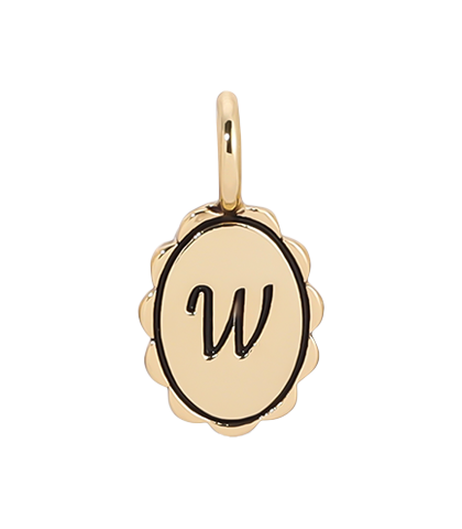 A gold charm with a scalloped edge features a cursive letter 'W.'