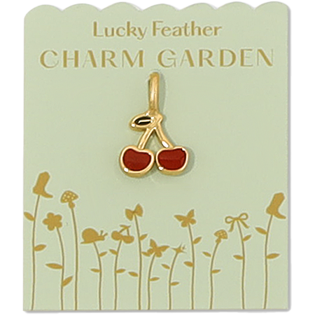 A gold cherry charm is centered on a light green 'Lucky Feather Charm Garden' display card.