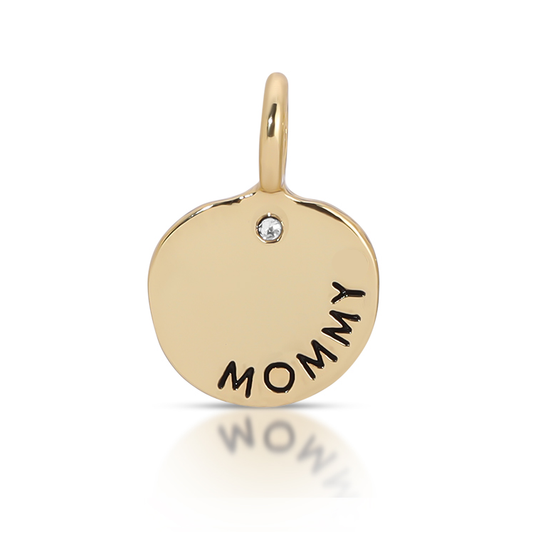 A gold charm pendant with the word 'mommy' inscribed.
