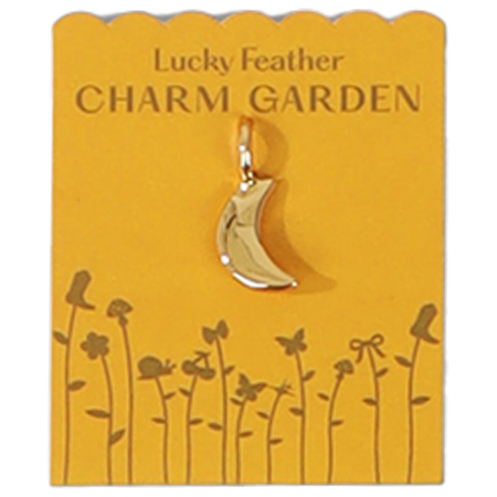 A golden crescent moon charm is displayed on a 'Lucky Feather Charm Garden' card with flower and butterfly graphics.