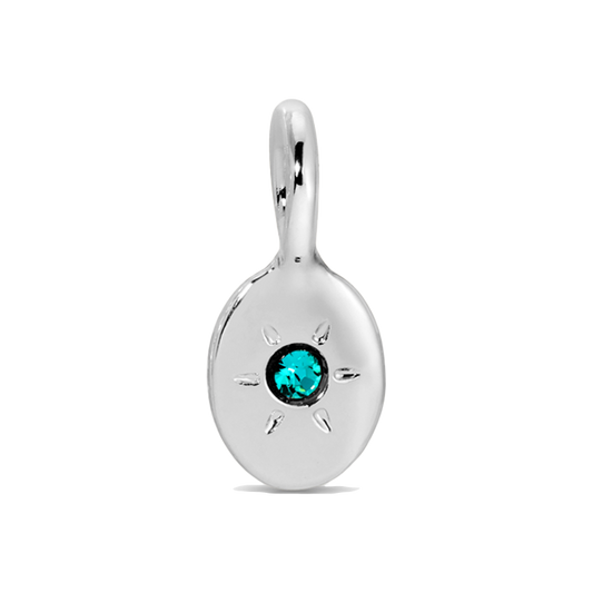 A shiny silver pendant with a teal gemstone.