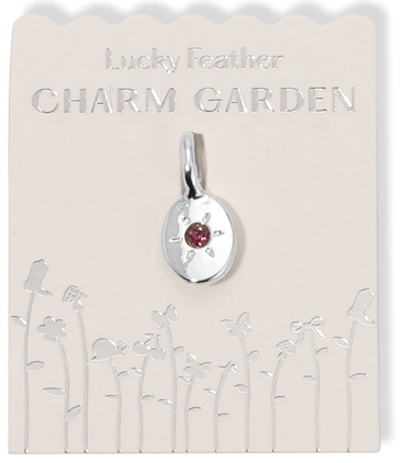 A 'Lucky Feather Charm Garden' jewelry charm on a display card.