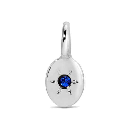 Silver pendant with a blue gemstone.