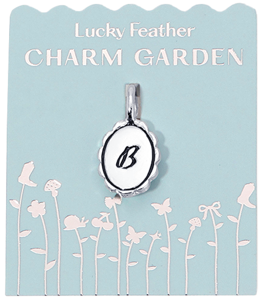 A 'Lucky Feather Charm Garden' pendant with the letter 'B' on a blue card with a floral design.