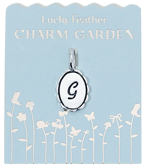 Lucky Feather Charm Garden display card with a 'G' pendant.