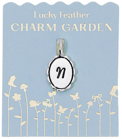 A charm with the letter N hangs on a 'Lucky Feather Charm Garden' card.
