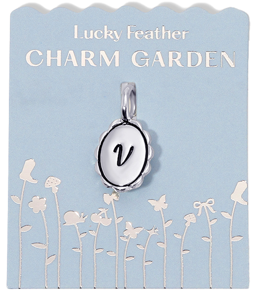 Silver initial 'V' charm from the 'Lucky Feather Charm Garden' collection, displayed on a light blue floral background.