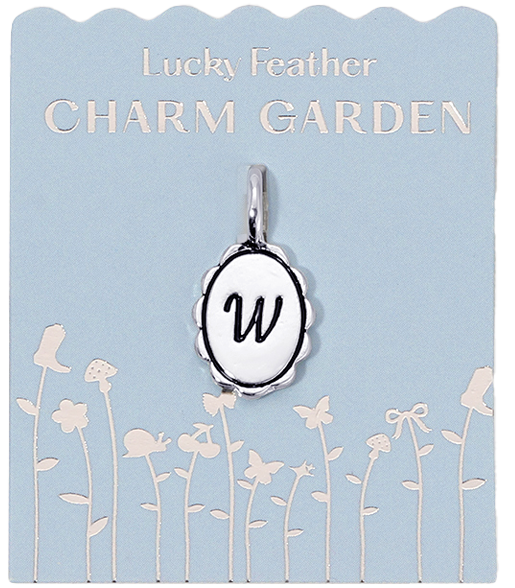 Lucky Feather Charm Garden card featuring an oval pendant charm with the letter 'W' on a blue background with a garden design.