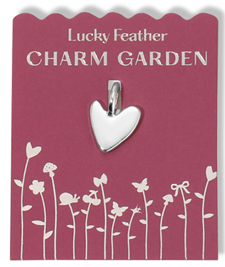 A 'Lucky Feather Charm Garden' card with a silver heart pendant.