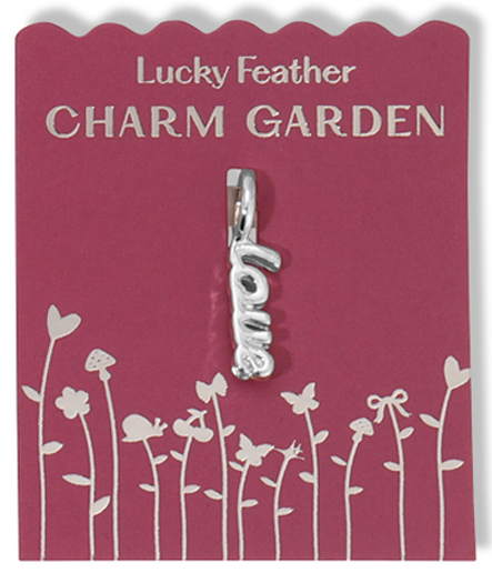 A 'love' charm hangs on a 'Lucky Feather Charm Garden' card.
