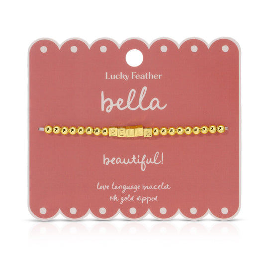A 'Bella' love language bracelet with gold beads on a pink scalloped card.