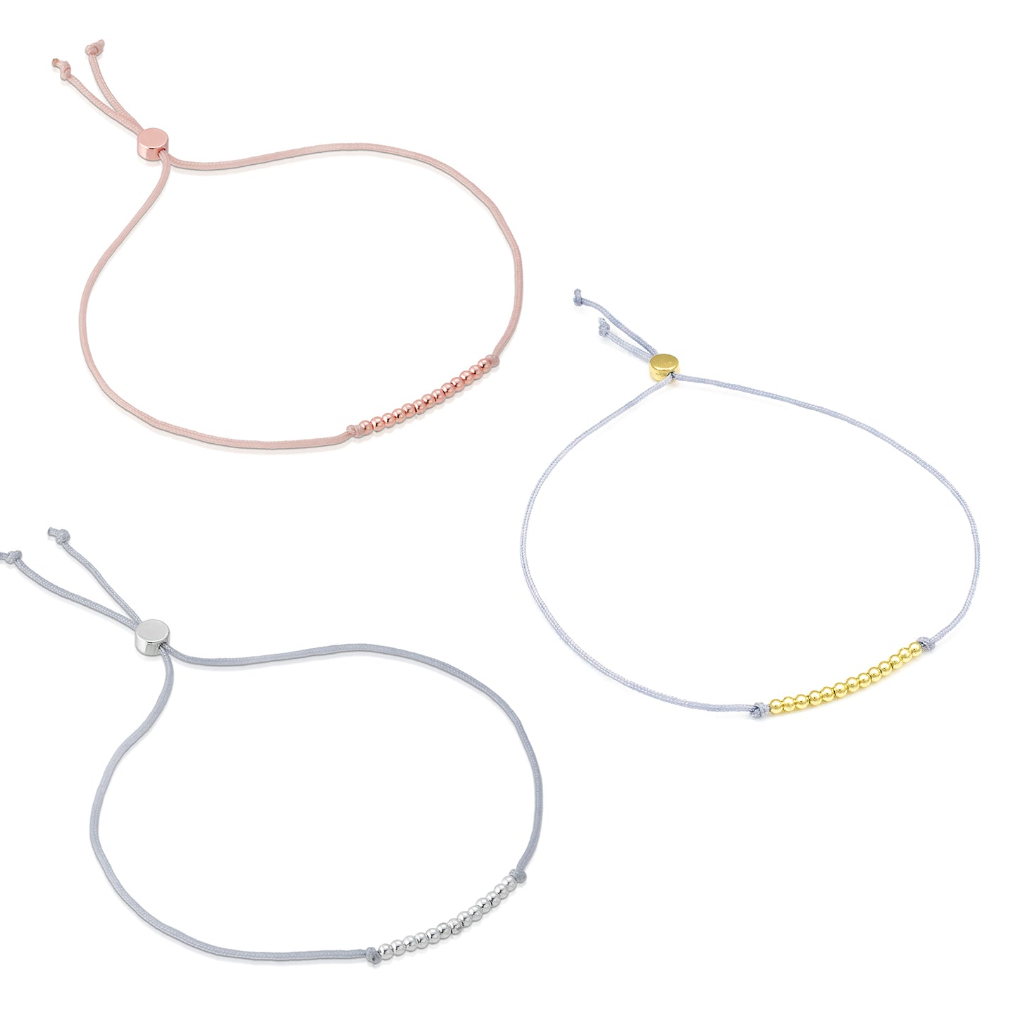 Three cord bracelets with metallic beads on a white background.