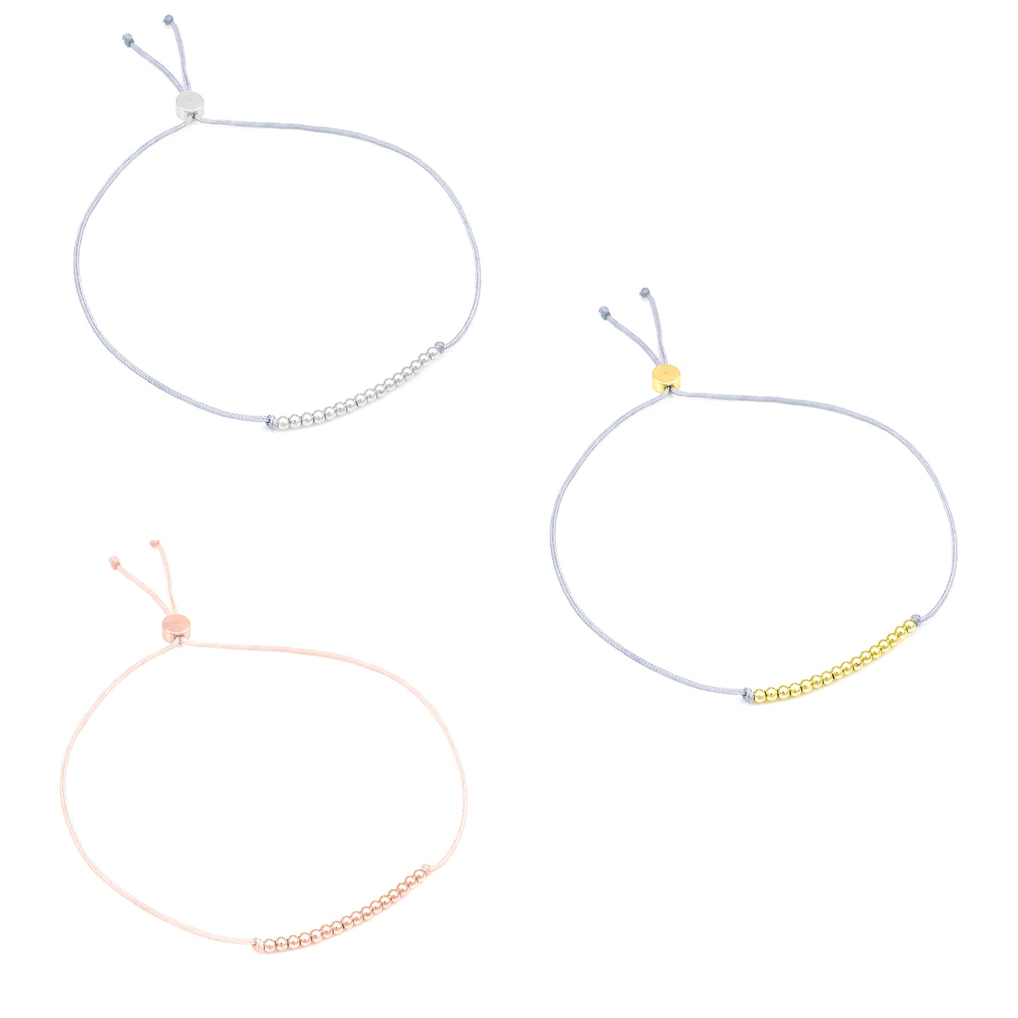 Three adjustable string bracelets with small metal beads on each.