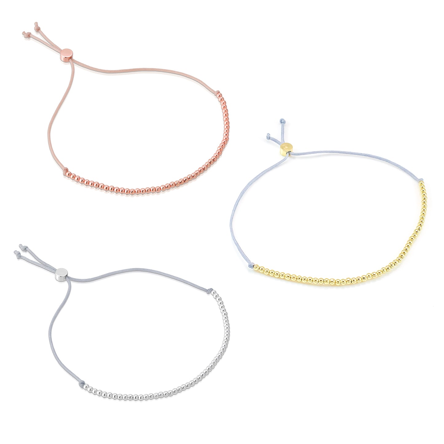 Three adjustable bracelets with metal beads on colored cords.