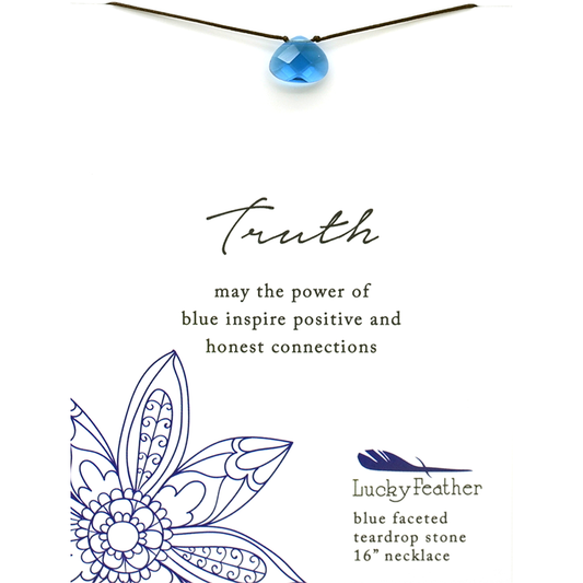 A blue teardrop pendant necklace with a card that reads 'Truth' and describes the necklace as a 'blue faceted teardrop stone 16' necklace' from Lucky Feather.
