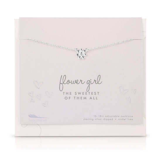 Silver 'Flower Girl' necklace with a flower charm displayed on its branded light pink packaging.