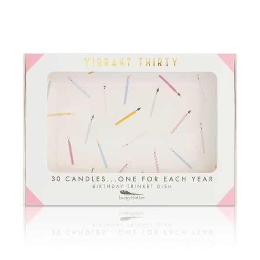 A 'Vibrant Thirty' birthday trinket dish box features a window showing a design of scattered colorful candles.