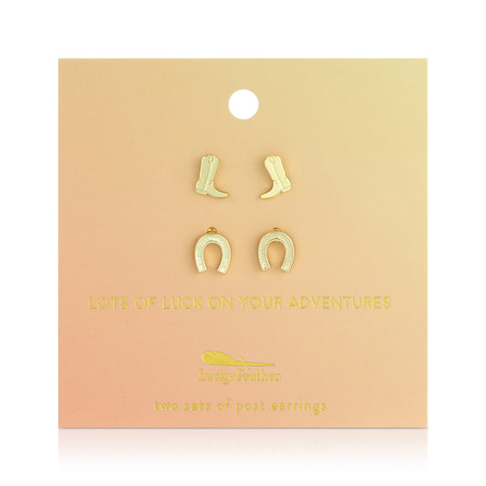 Two sets of earrings (cowboy boots and horseshoes) are displayed on a peach colored card.