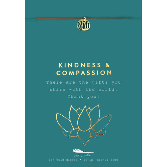 Teal card with a gold charm, lotus flower illustration, and the text 'Kindness & Compassion.'