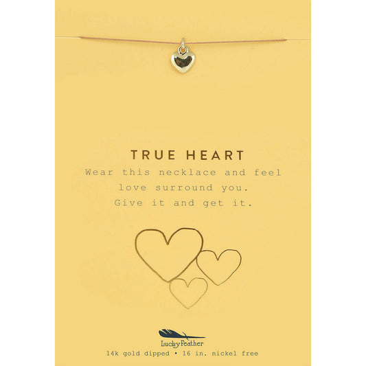 A 'True Heart' necklace on a yellow card with heart illustrations.