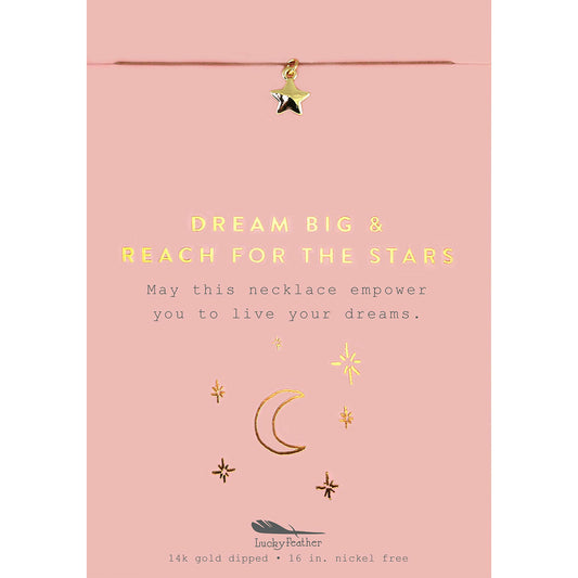 A pink card with a gold star charm hanging above text that reads 'DREAM BIG & REACH FOR THE STARS.'
