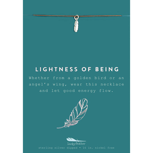 A teal card with a silver feather necklace and the words 'Lightness of Being'.